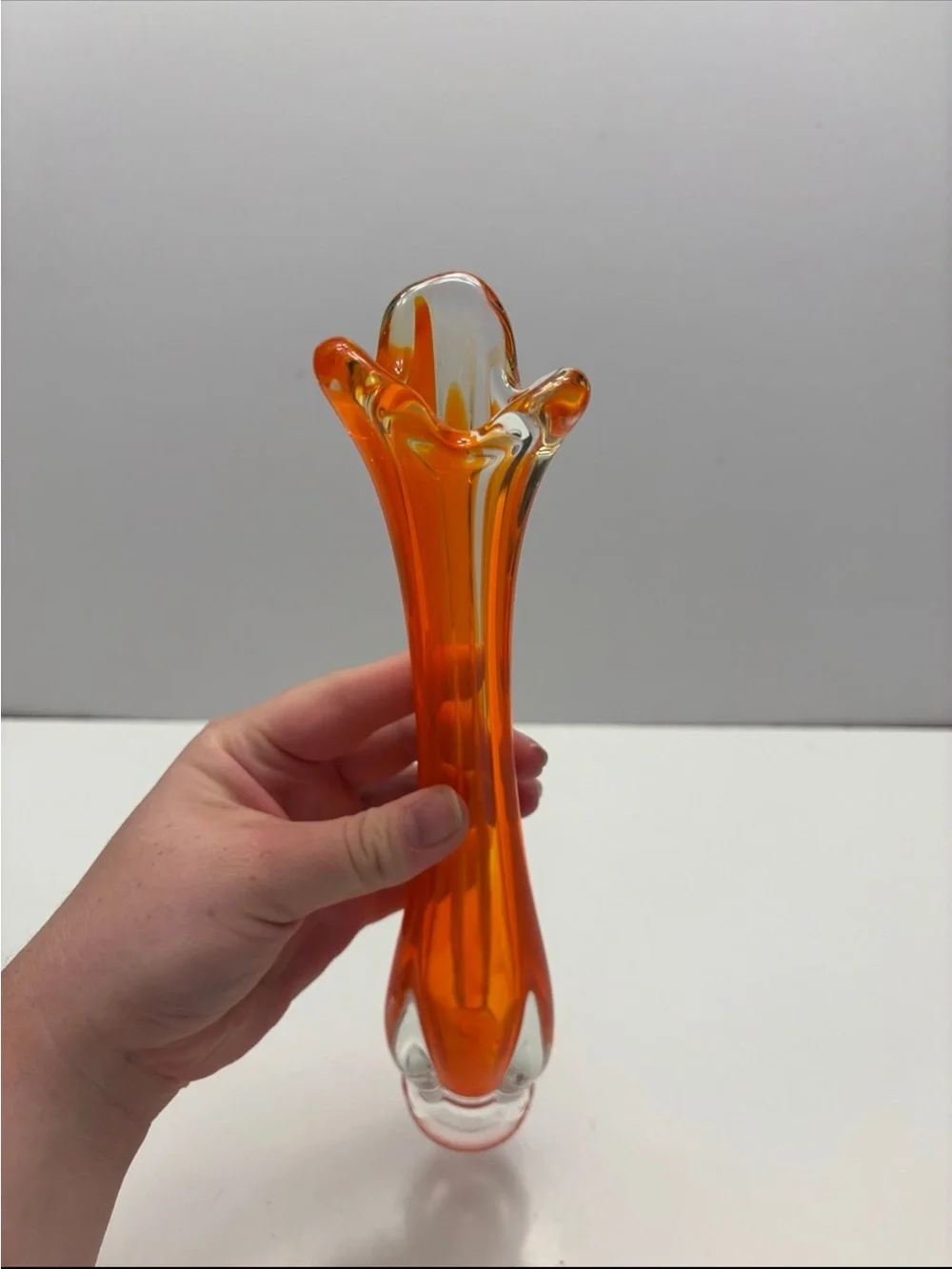 Vintage orange and clear glass swung bud vase
